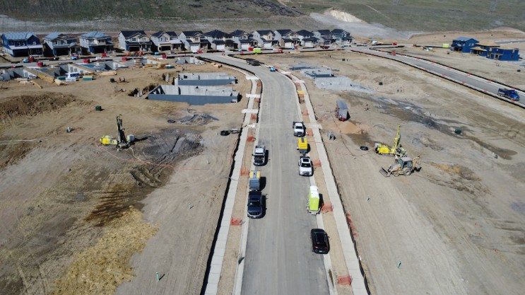 Aerial view of a Lennar Colorado community under construction, with Dandelion drill rigs working on homesites