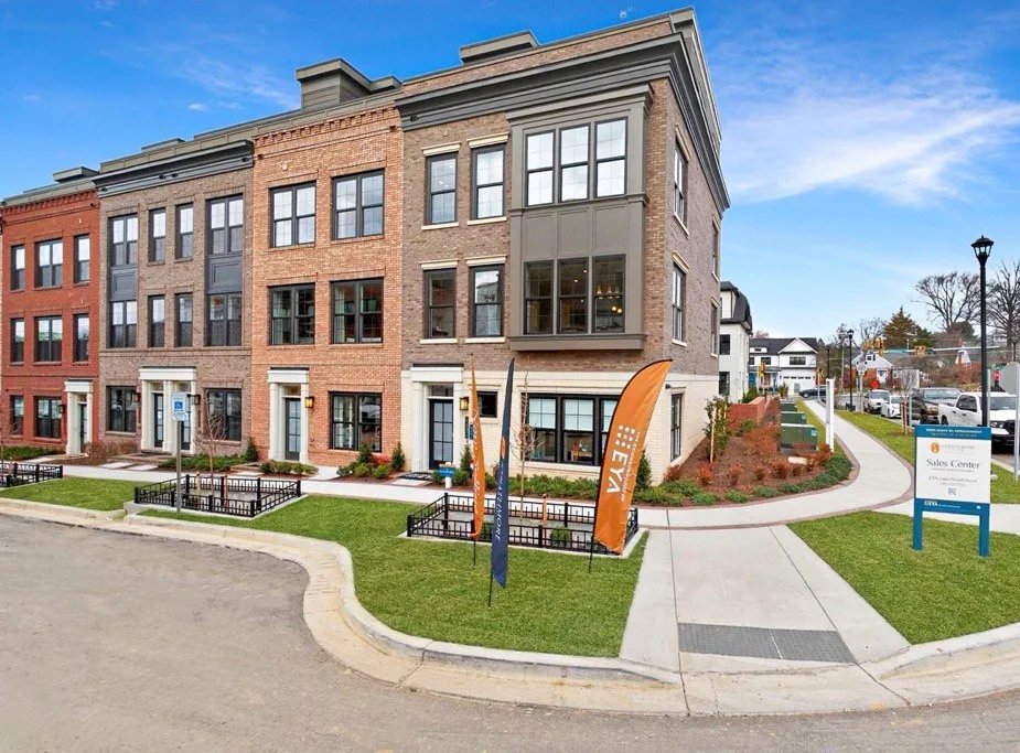 Brick brownstone townhomes and EYA sales center at Strathmore View in North Bethesda, Maryland